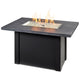 Linear gas fire table, carbon gray top and black base with lit glass burner