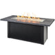 Linear gas fire table with charcoal gray top and black base, burning flame in center