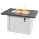 Linear gas fire table, carbon gray top and white base with lit glass burner