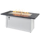 Linear gas fire table with charcoal gray top and white base, burning flame in center
