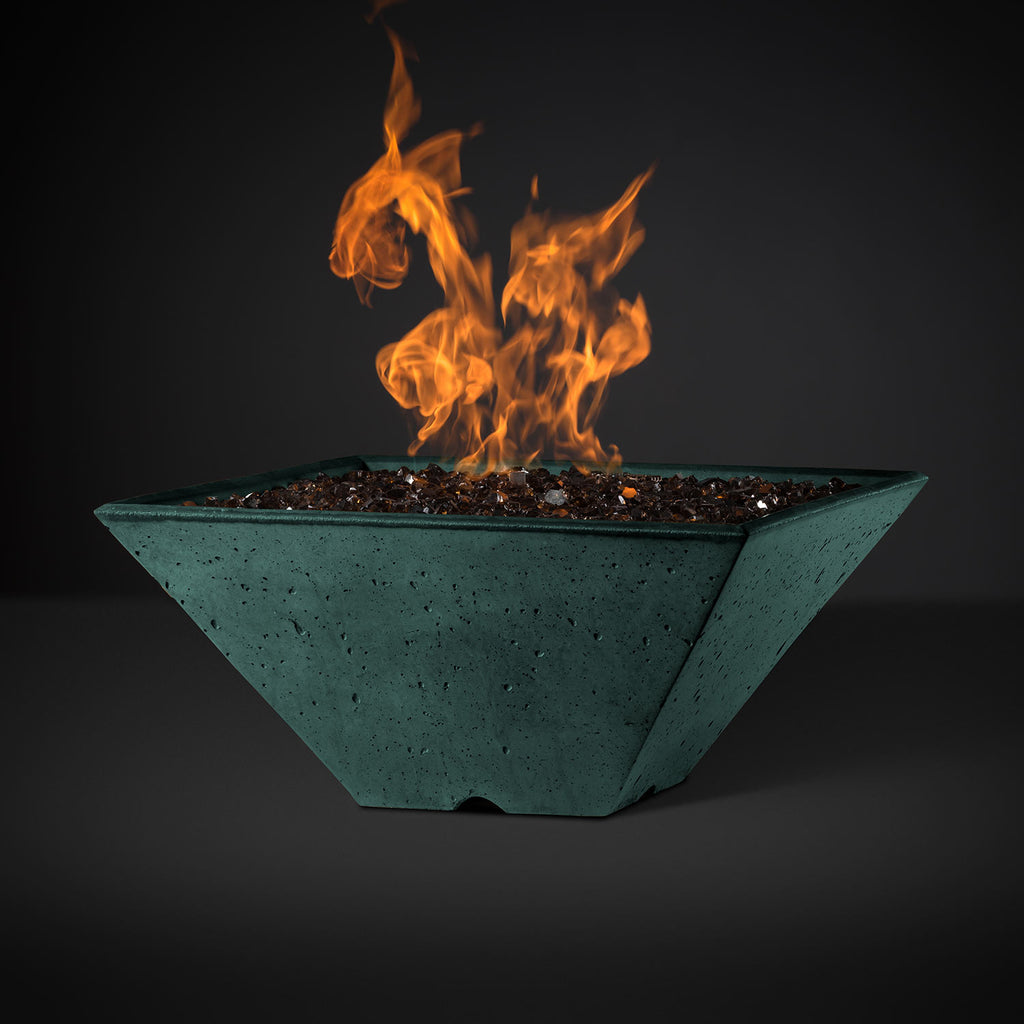 Square fire pit with orange flames and dark lava rocks in a teal basin