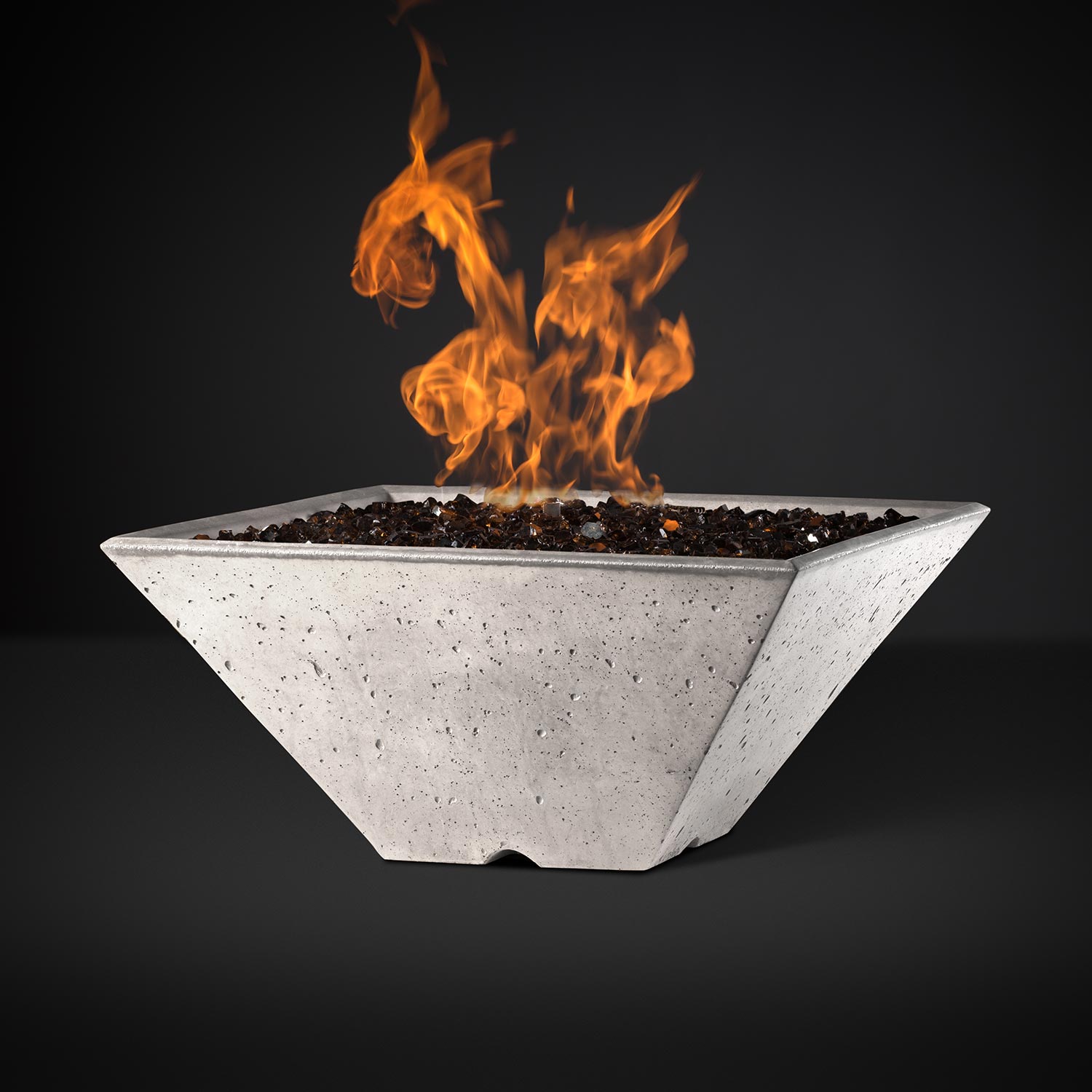Square fire pit with burning flames, white speckled bowl with black firebed