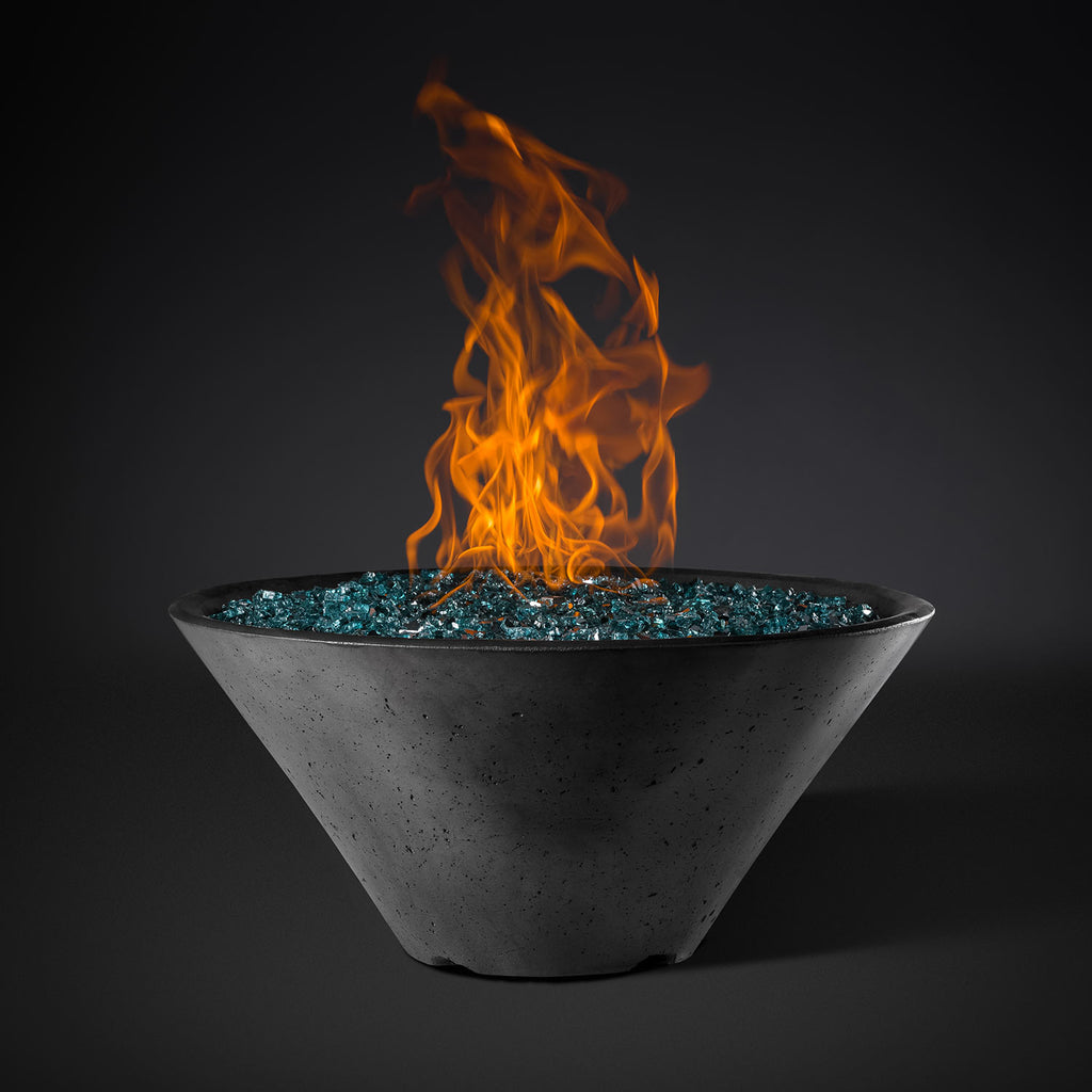 Round fire pit bowl in gray with orange flames and teal fire-glass top