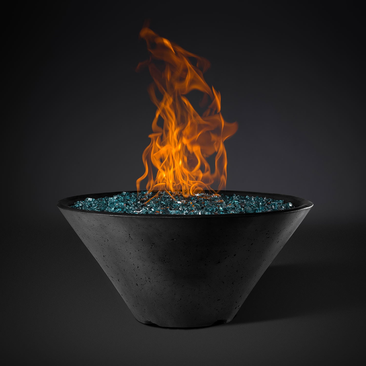 Round fire pit with flames and teal glass insert, dark gray speckled bowl