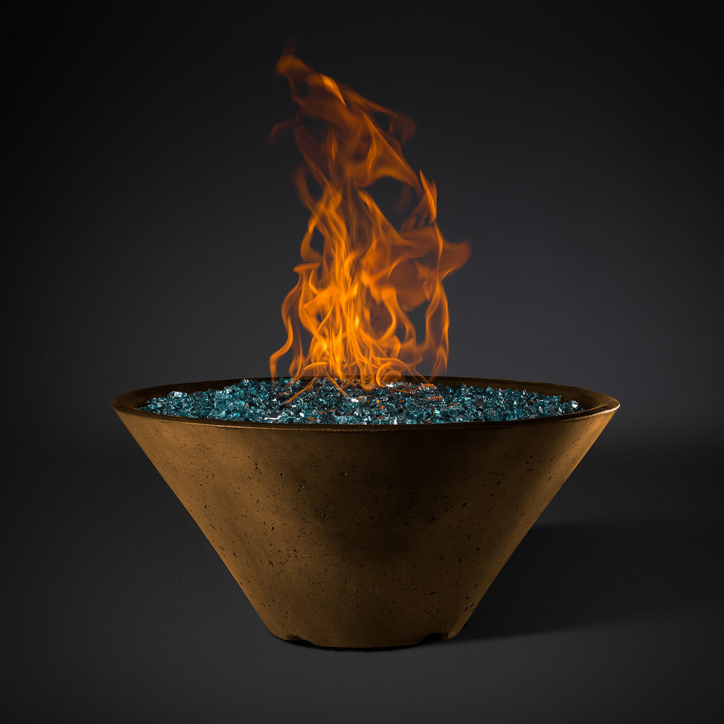 Round fire pit bowl with blue glass rock base and orange flames rising