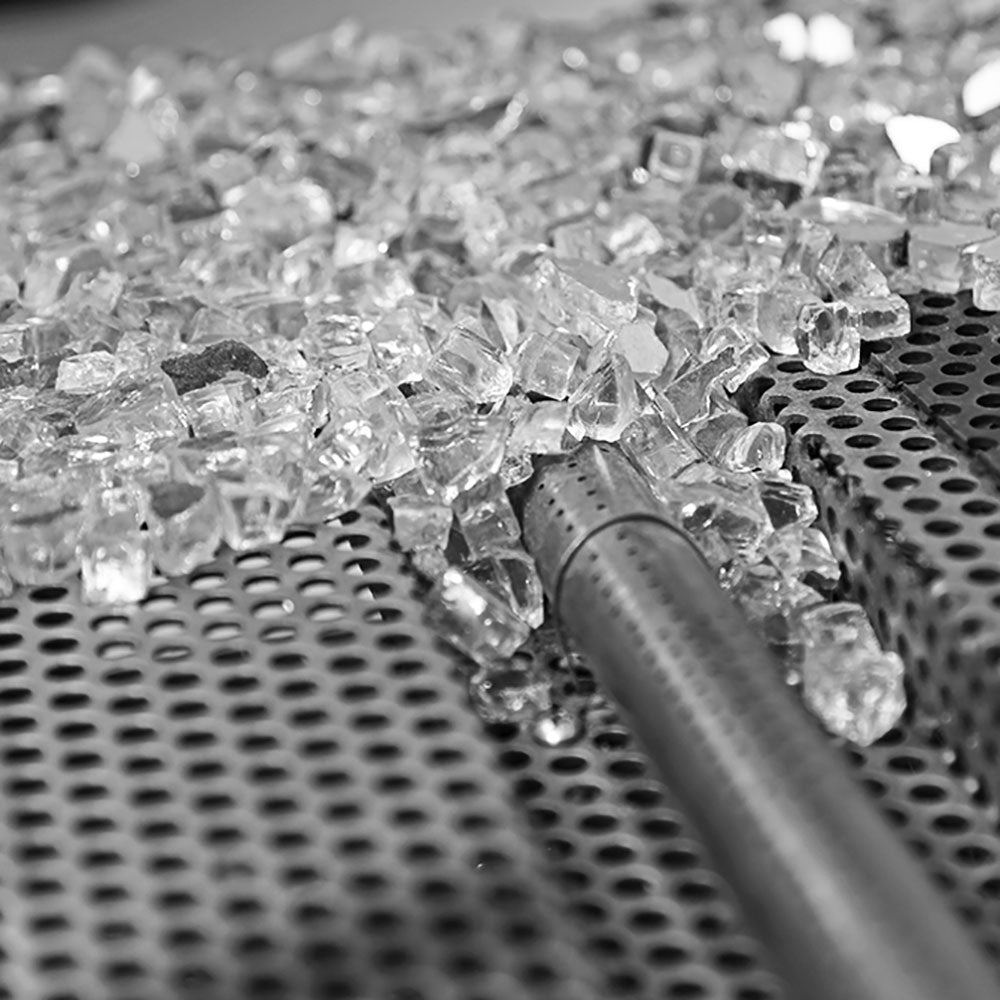 Vented burner grate with clear glass stones and metal igniter rod