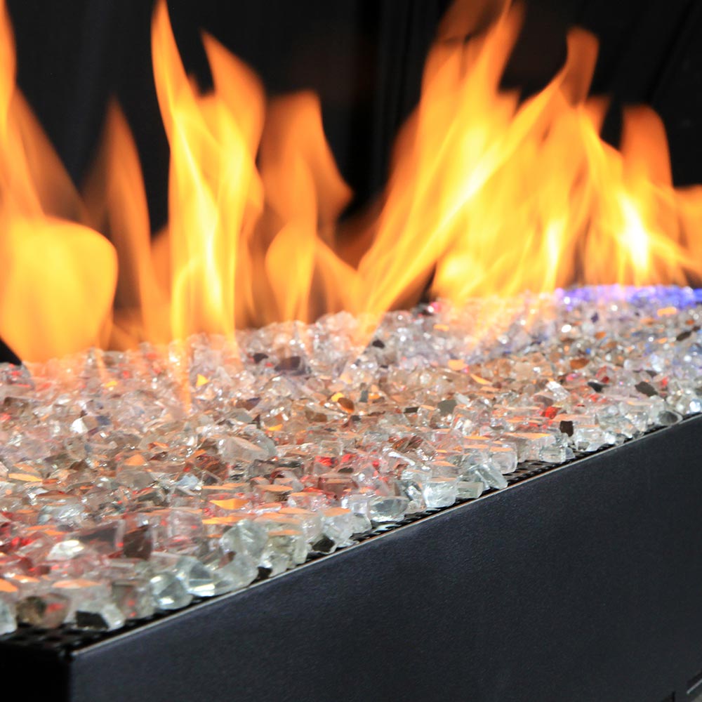 Vented linear burner with bright flames and clear glass stone bed