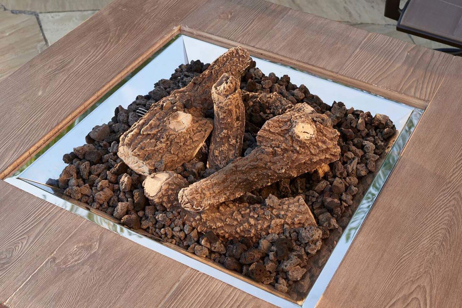 Gas fireplace log set with split logs in a burner tray