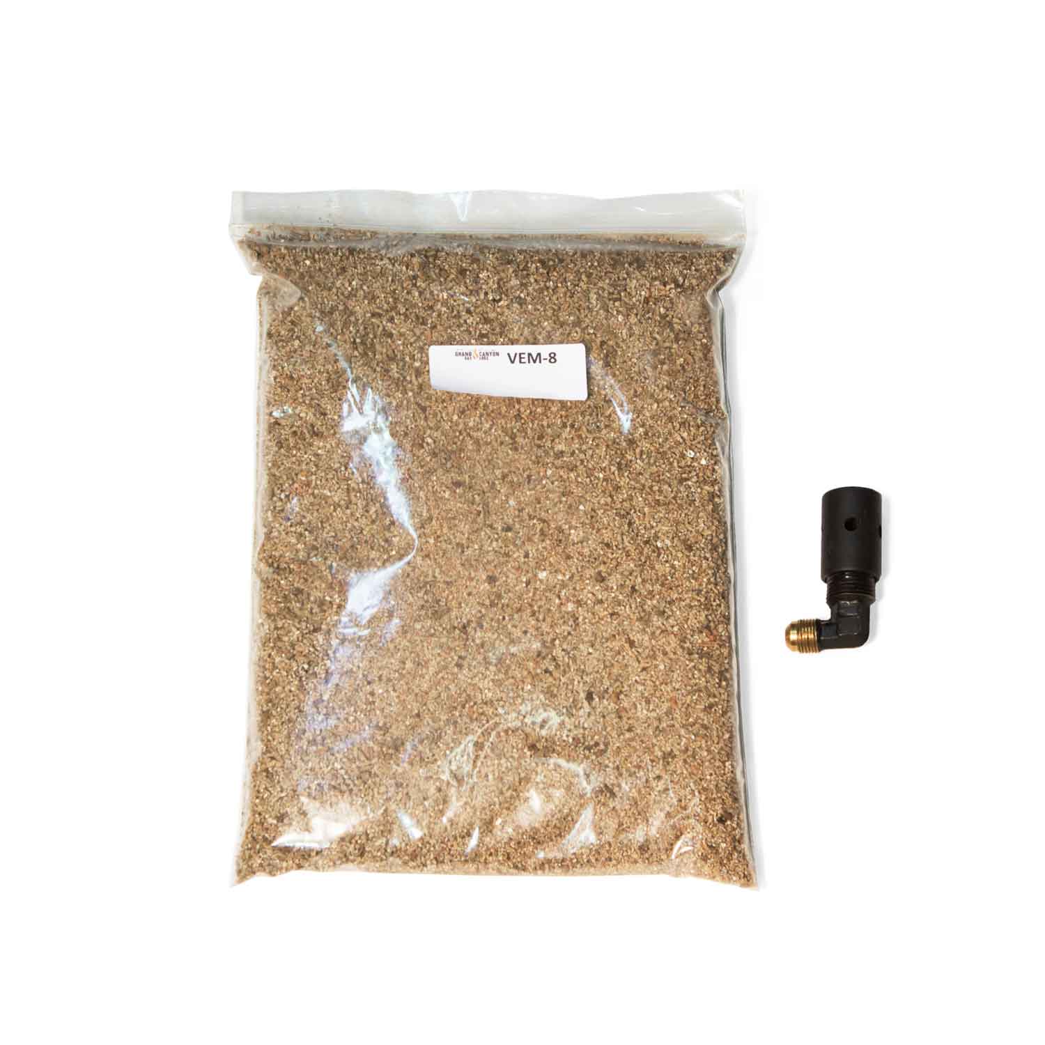 Propane conversion kit parts: bag of brown granular media and black gas valve fitting