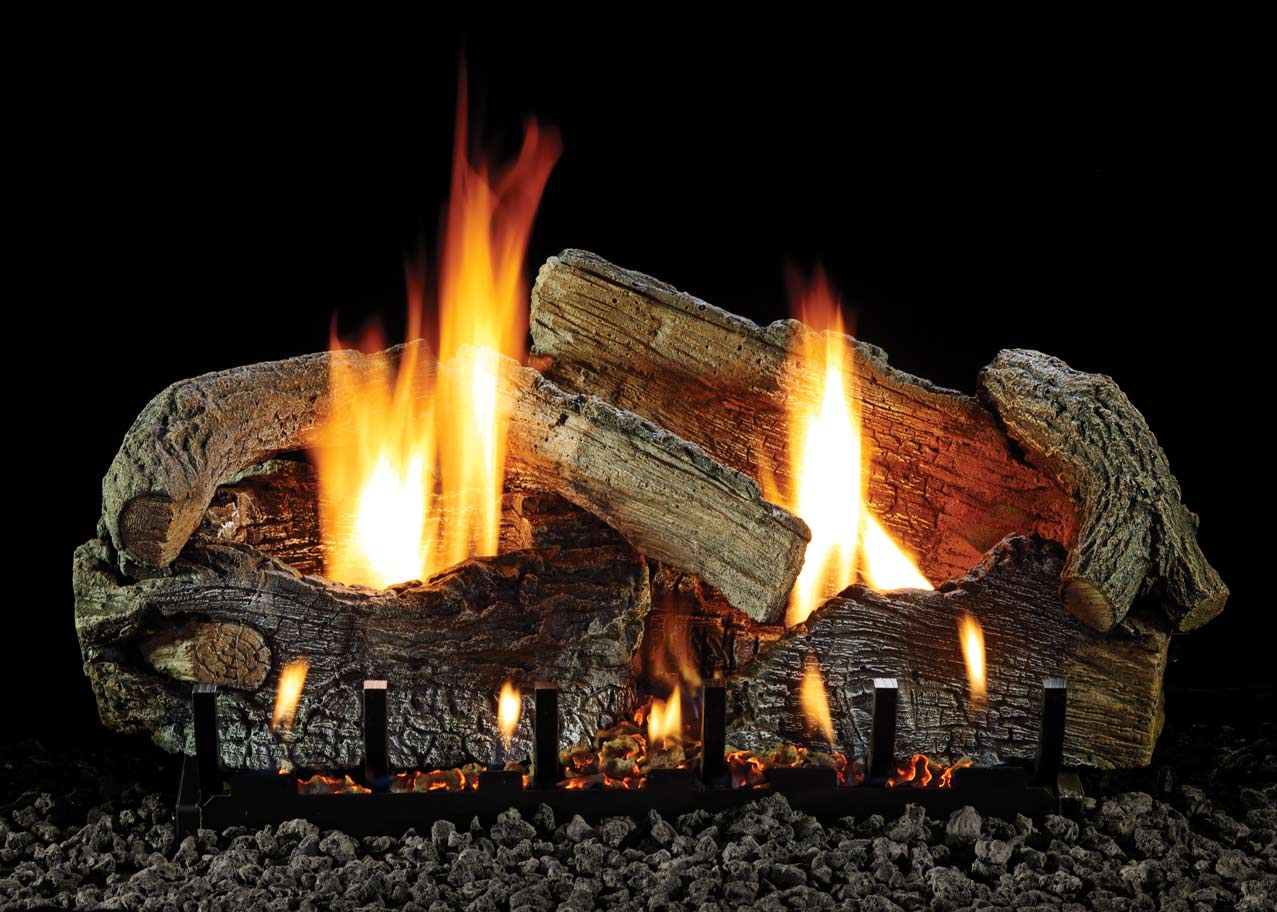 Aged oak gas logs with active flames and glowing embers