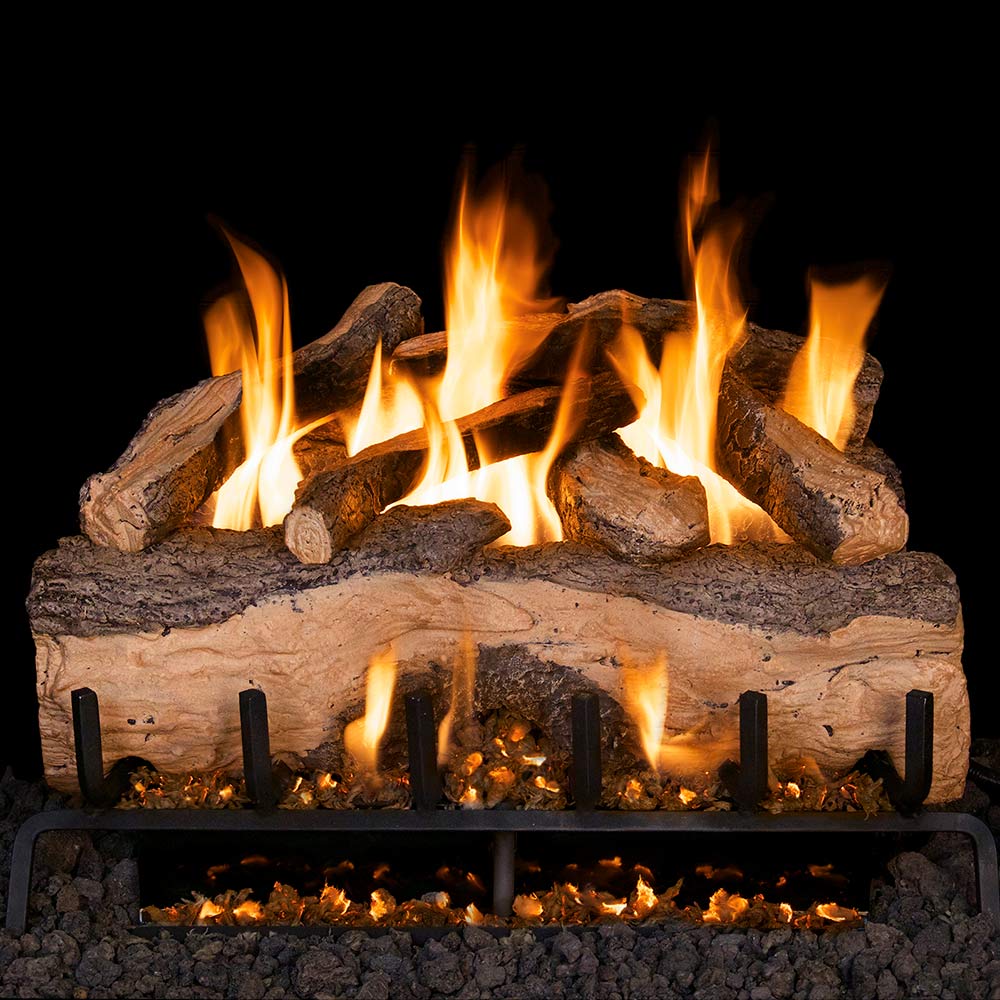Vented gas log set with split oak-style logs and glowing flames