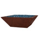 Low square fire bowl with blue glass fire media, reddish terracotta concrete finish