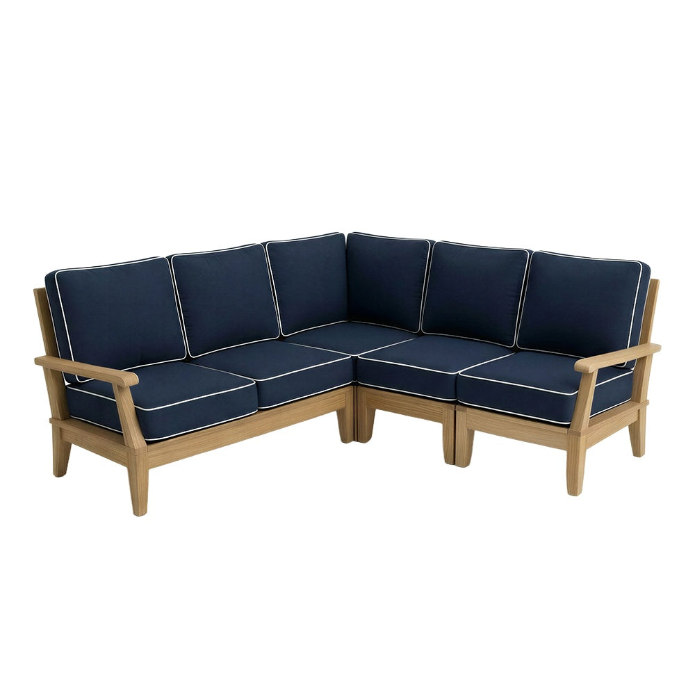 Large sectional sofa with navy cushions and light piping, corner configuration