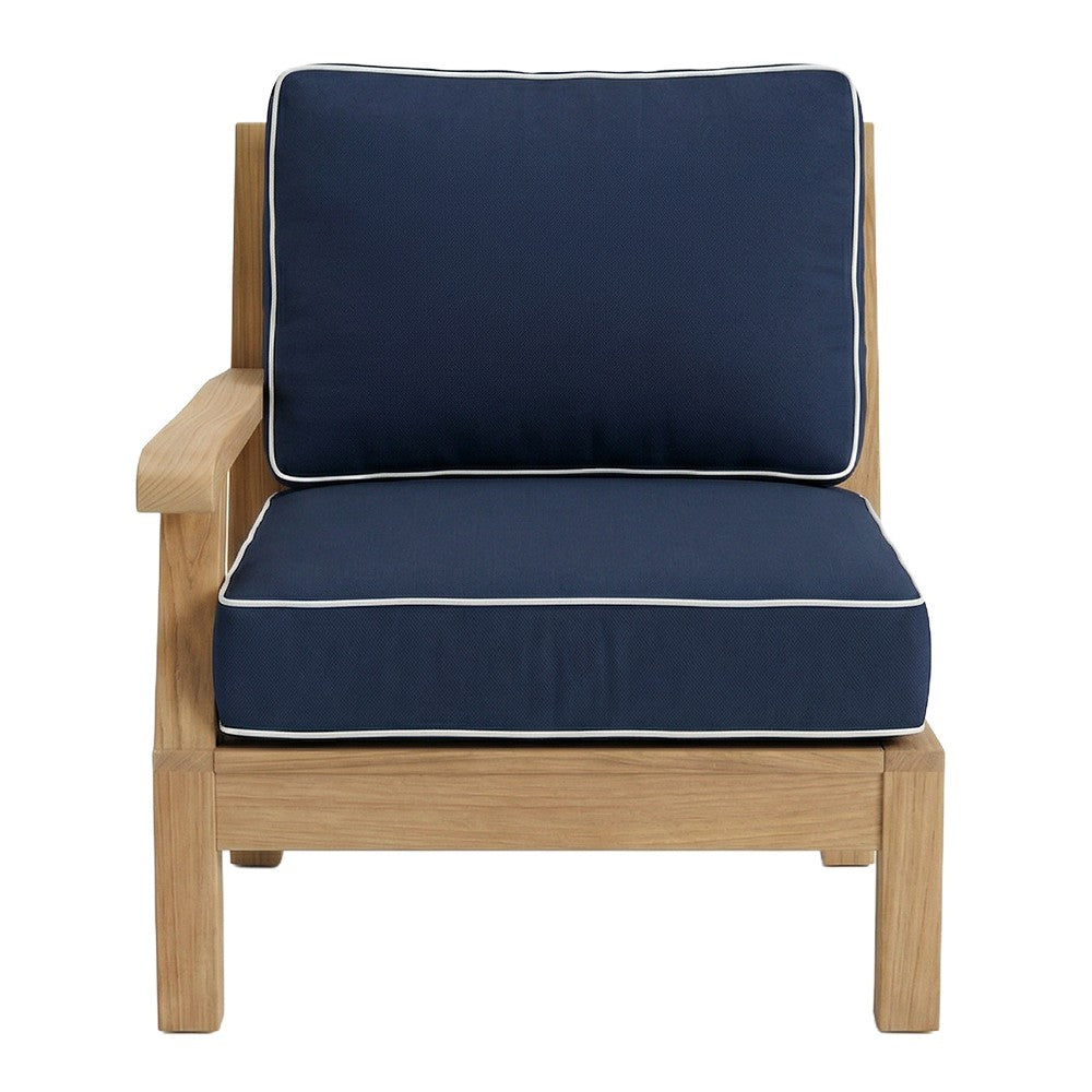 Teak outdoor armchair cushion set with dark blue fabric and light piping