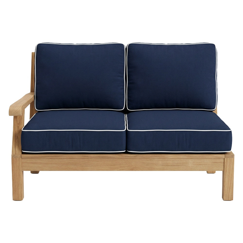 Left arm facing loveseat with dark blue cushions, light wood frame, white piping