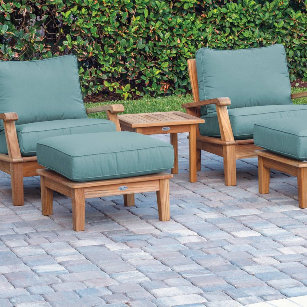 Teak outdoor ottoman with teal cushion and square seat on wooden legs