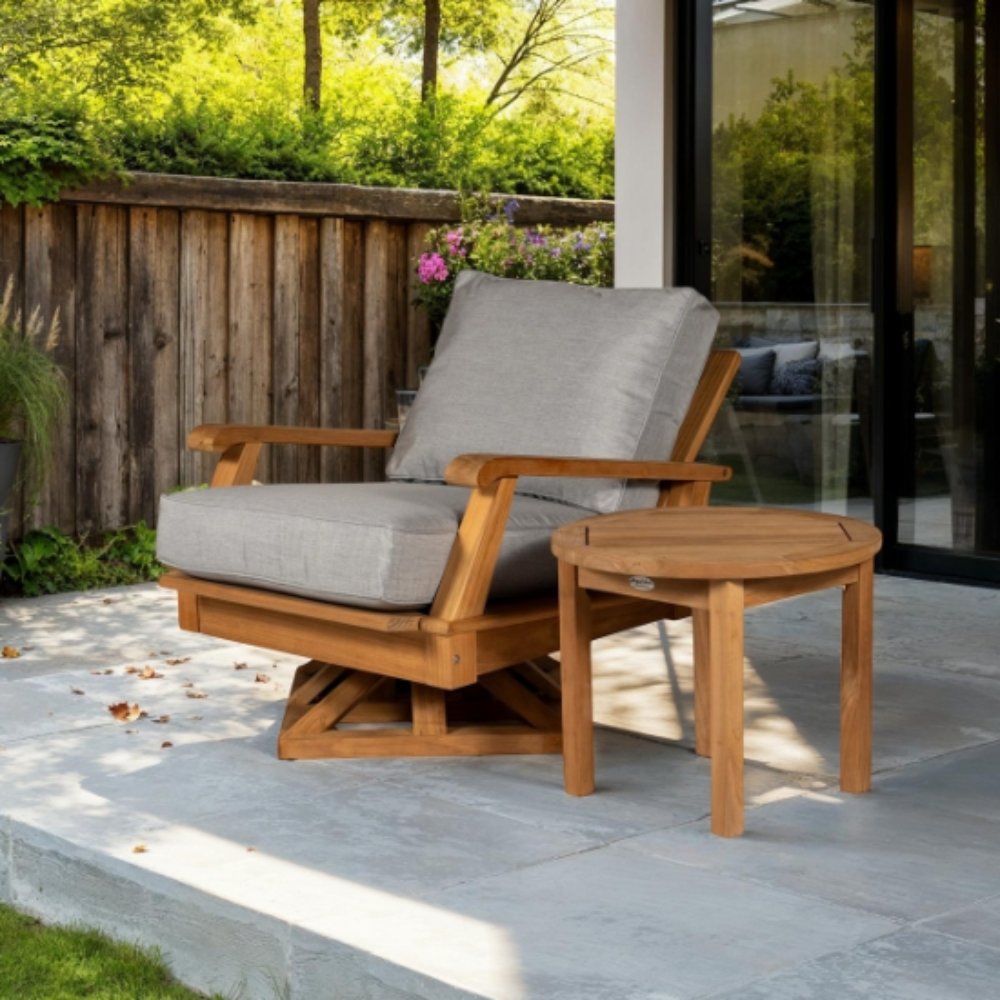 Teak swivel chair with light gray cushion on an outdoor patio.