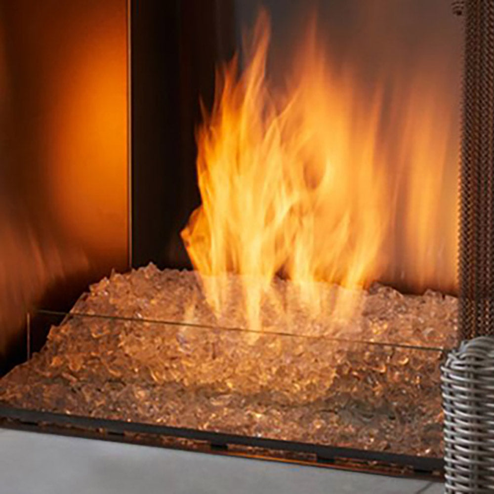 Outdoor gas fireplace burner kit with open flames over lava rocks
