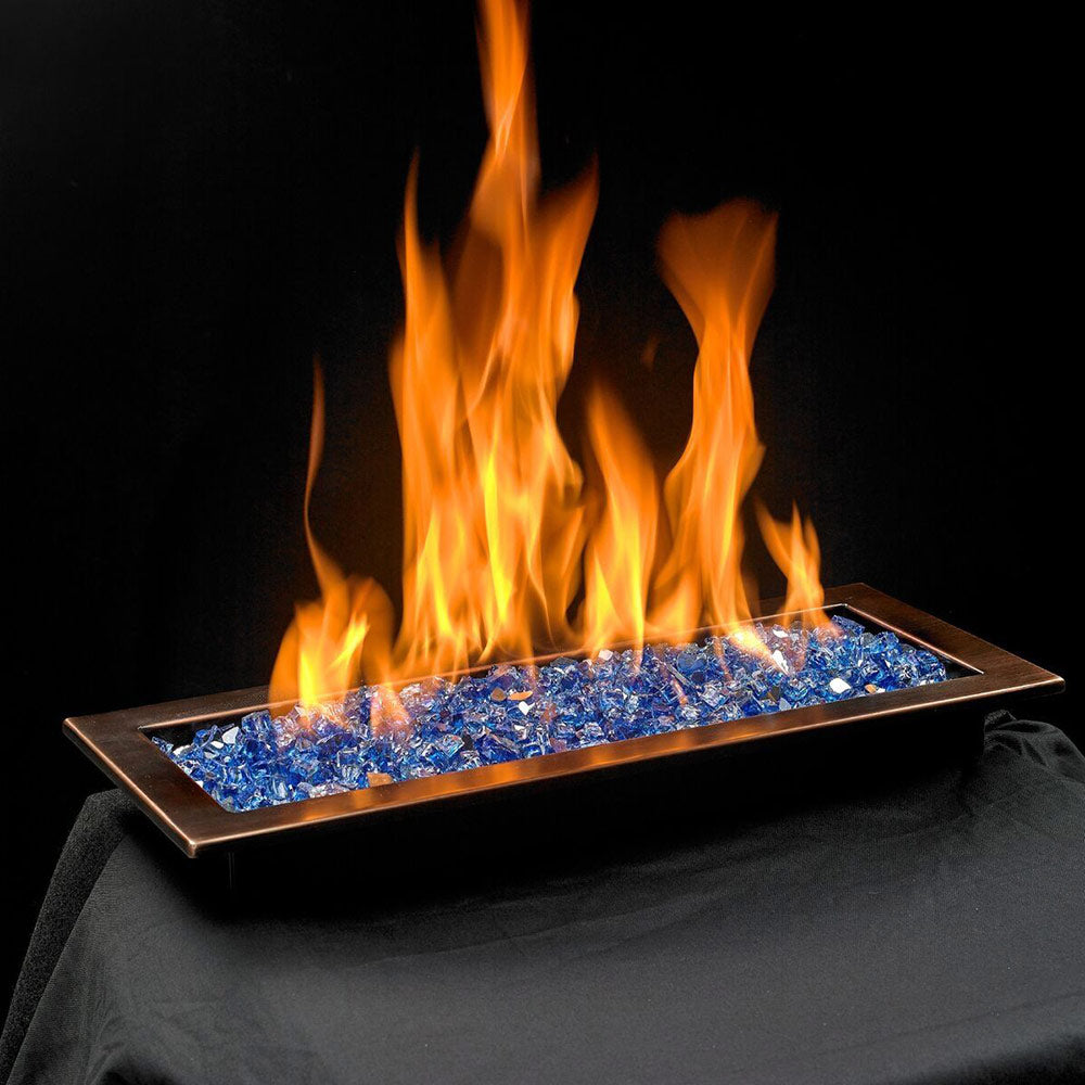 Rectangular gas fire pit burner with blue glass media and tall flames