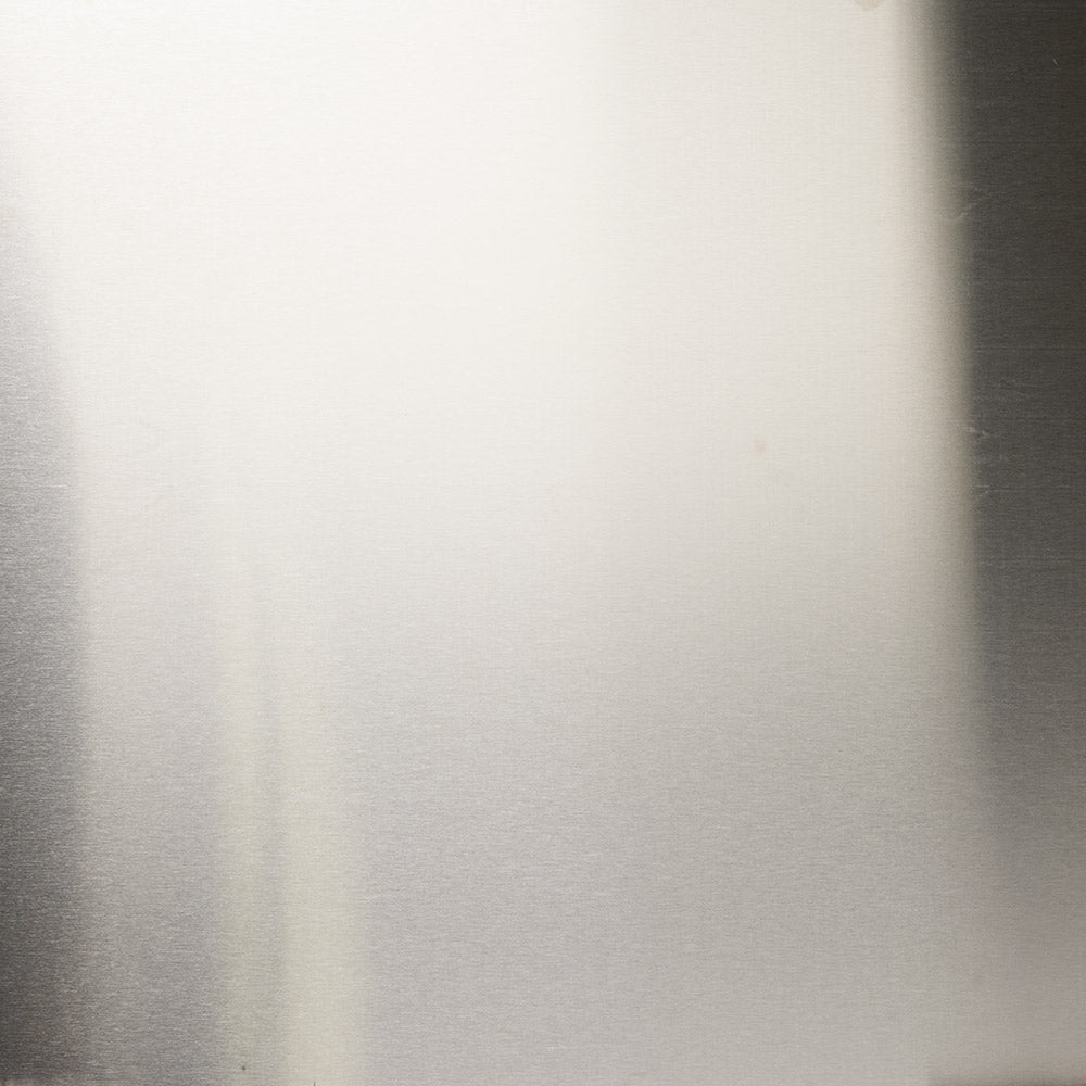 Stainless steel refractory panel with brushed metal finish