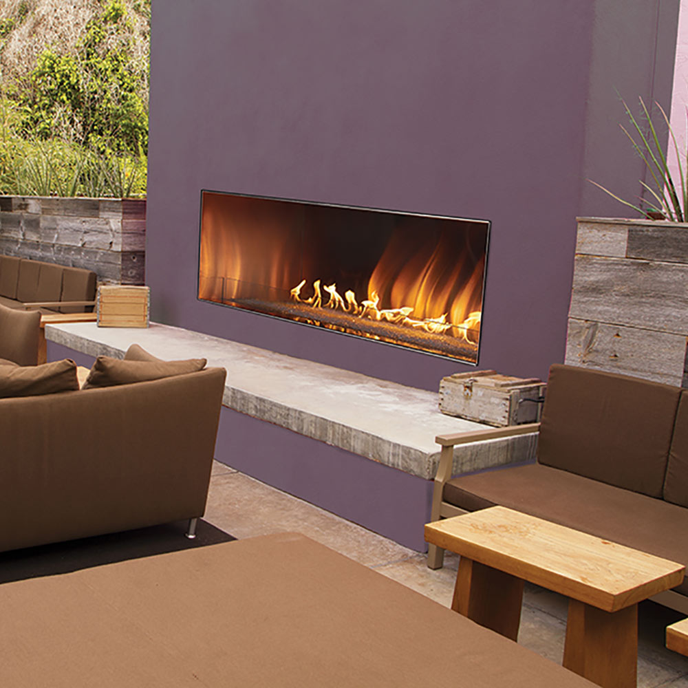 Outdoor linear fireplace with rectangular glass front and visible flames
