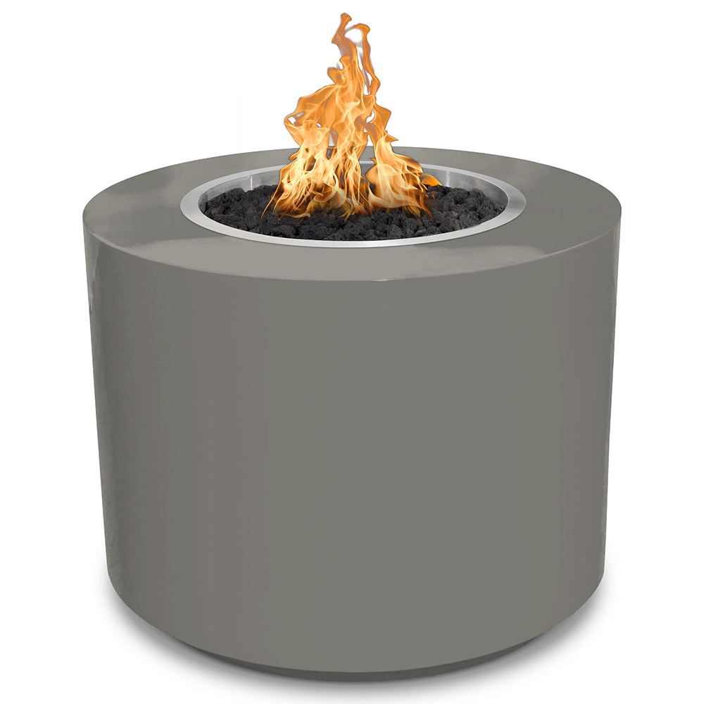 Gray round gas fire pit with flames rising from a charcoal-filled burner ring