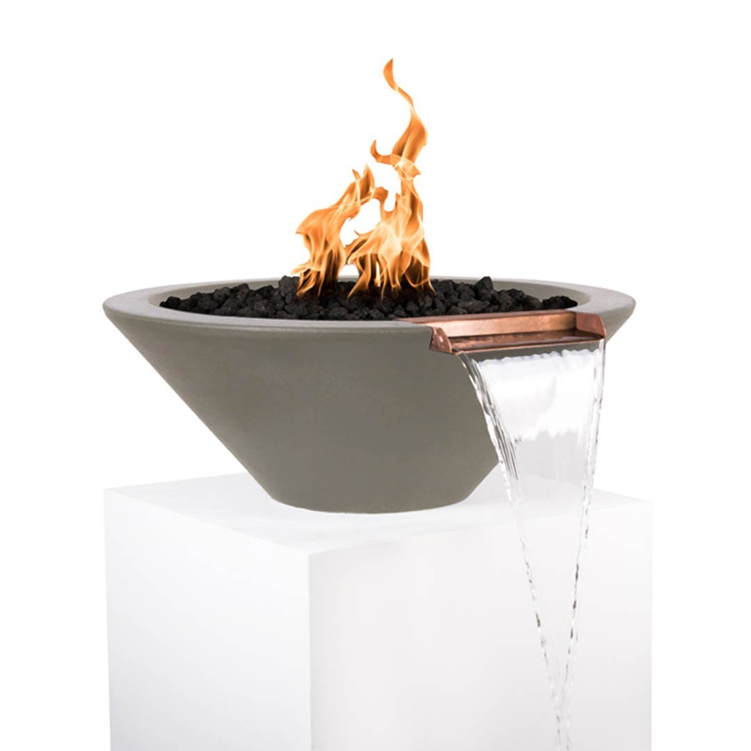 Grey round concrete fire and water bowl with flames over black lava rocks and water stream