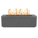 Linear gas fire pit with dark gray steel body and burning flames from open burner