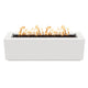White linear gas fire pit with flames across the burner opening