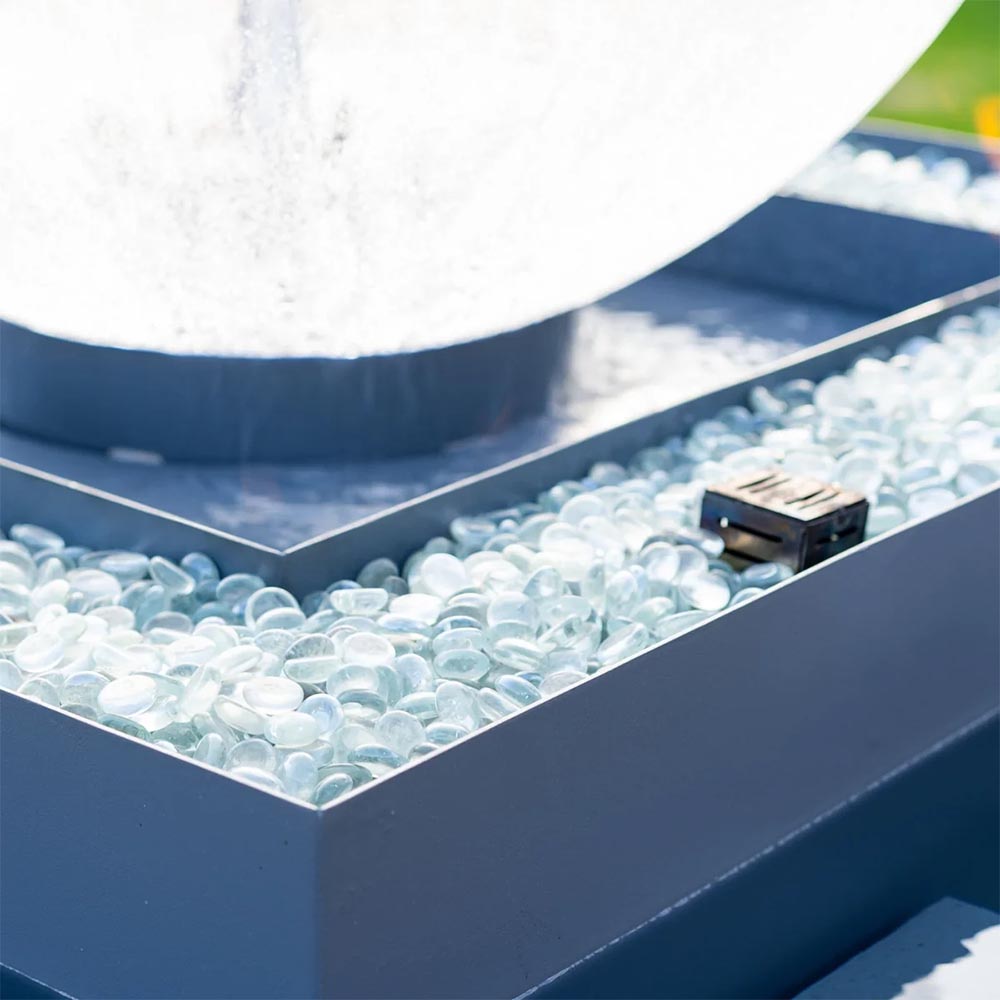 Close-up of clear water bubbles in the lower pool of an outdoor fire bowl