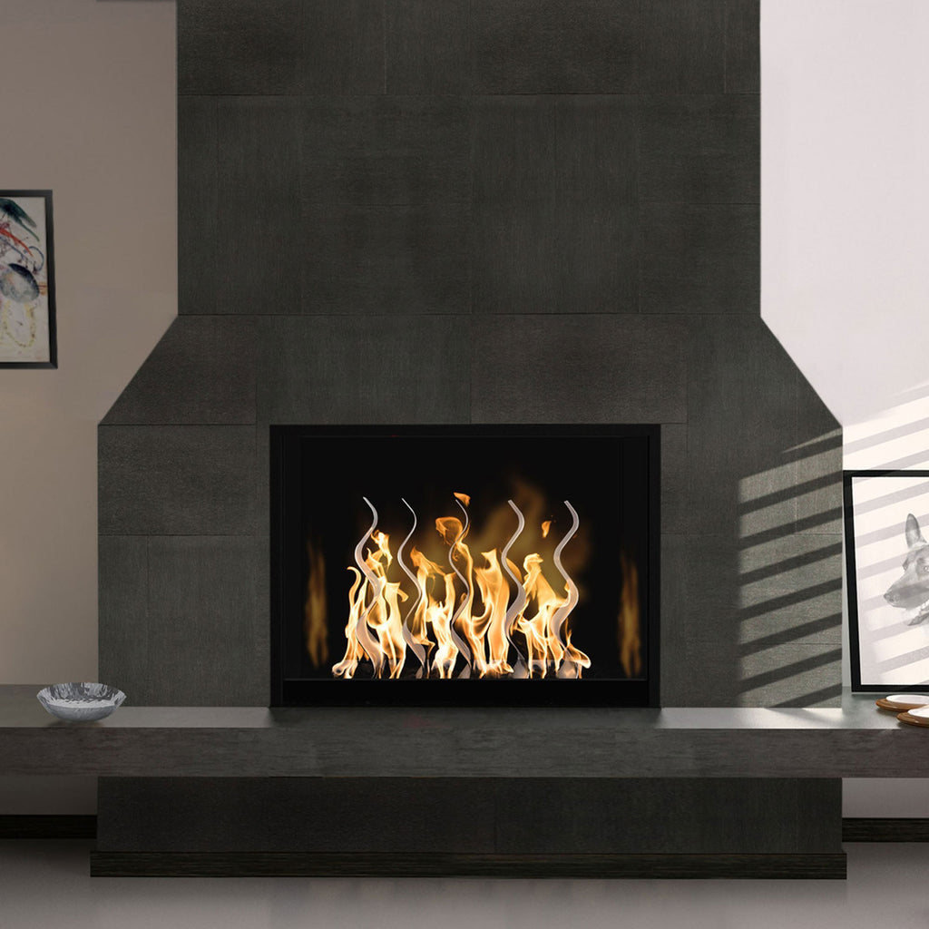 Indoor fireplace with black firebox and stainless steel wave flame screen