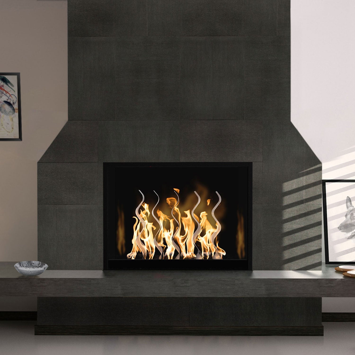 Indoor fireplace with black firebox and stainless steel wave flame screen