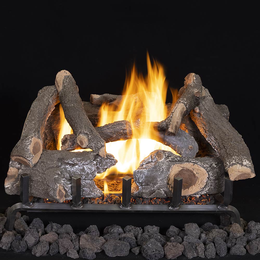 Charred ceramic fiber gas log set with glowing flames and dark gray log pieces