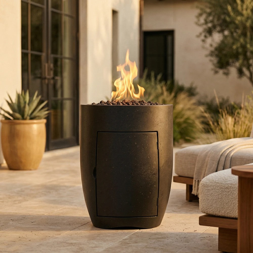 Dark gray concrete propane gas fire pit with rectangular front panel and burning logs