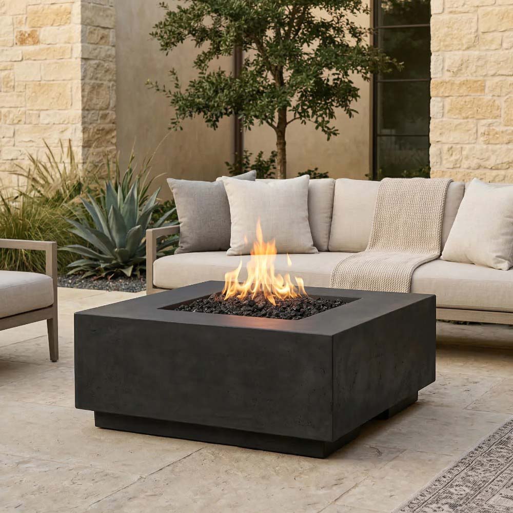 Dark charcoal concrete gas fire pit with flames and square firebox opening