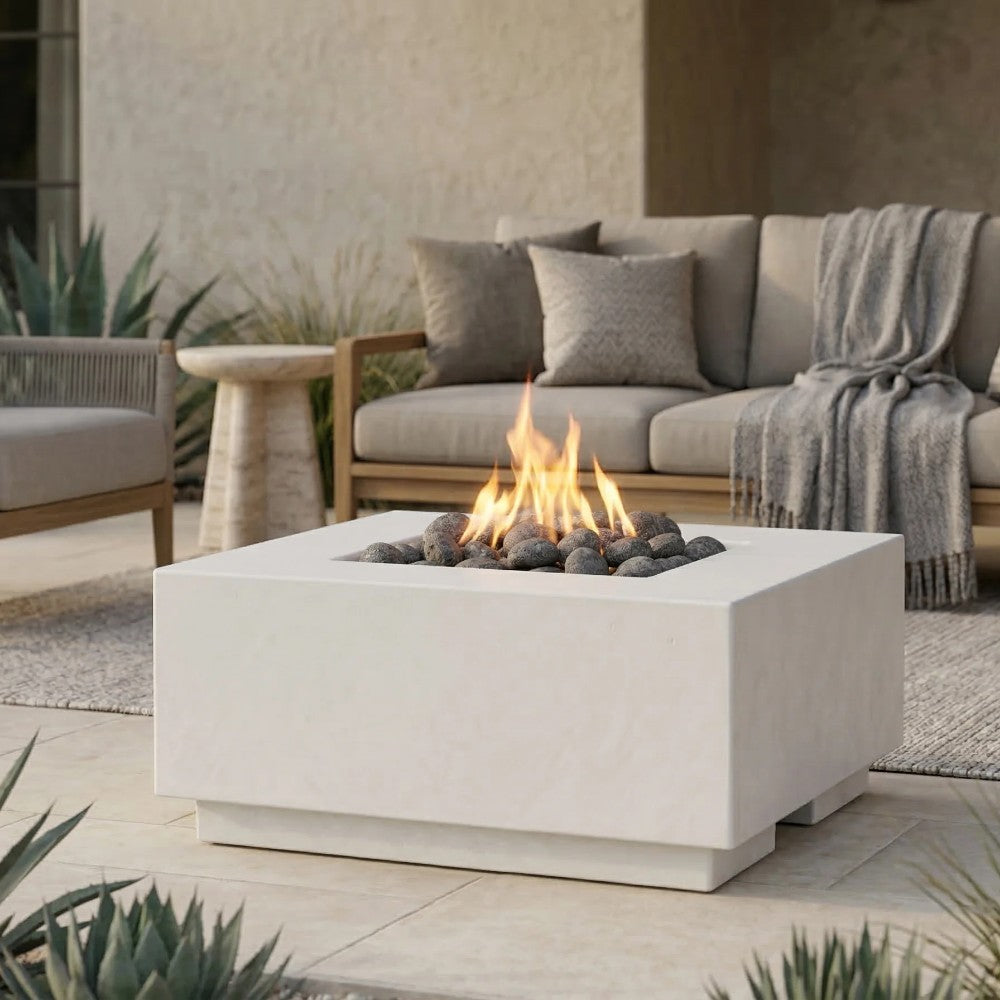 Light gray concrete gas fire pit with flames in a square tabletop design
