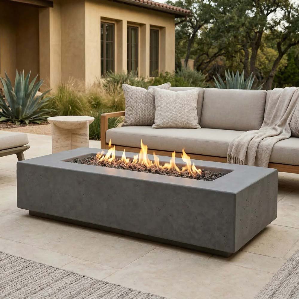 Gray concrete gas fire pit with square flame bowl and surrounding low rectangular base