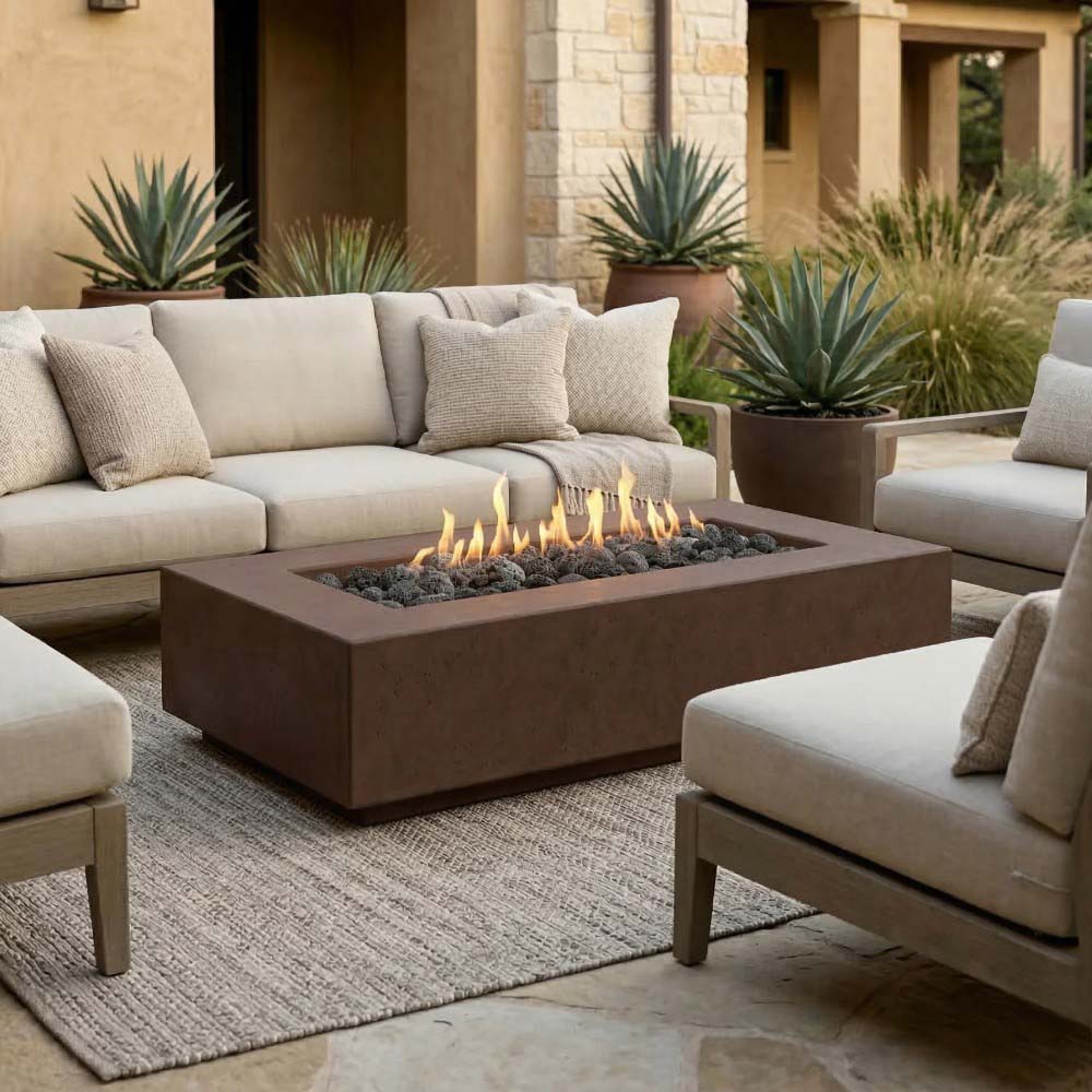 Concrete gas fire pit with square opening and visible flames in the burner bowl