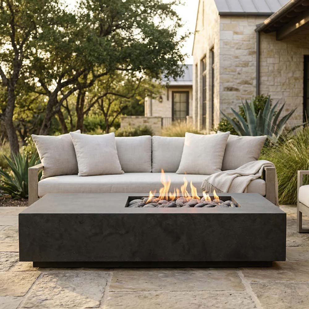 Rectangular concrete gas fire pit with visible flames, dark charcoal finish