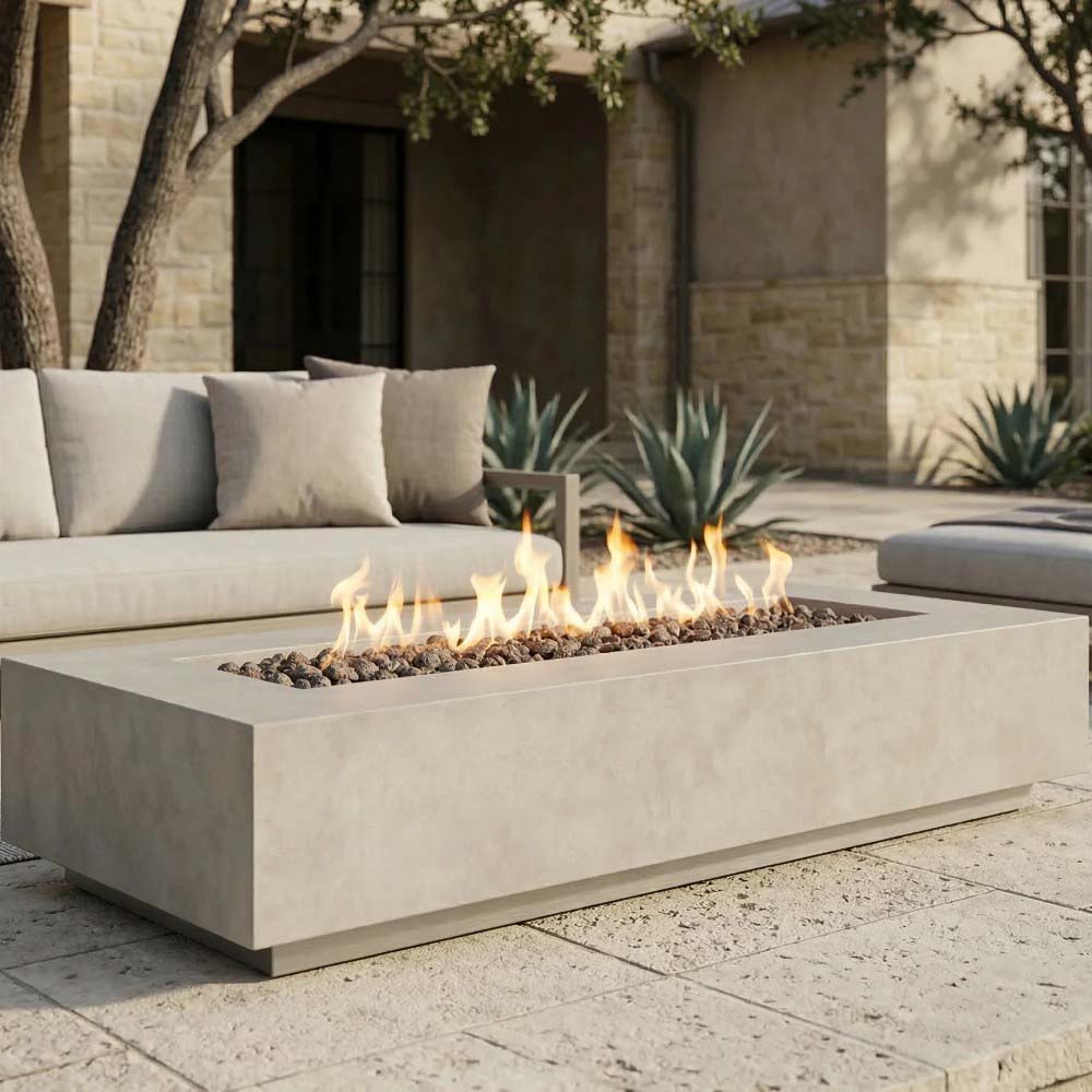 Light gray concrete gas fire pit with flames in rectangular burner tray