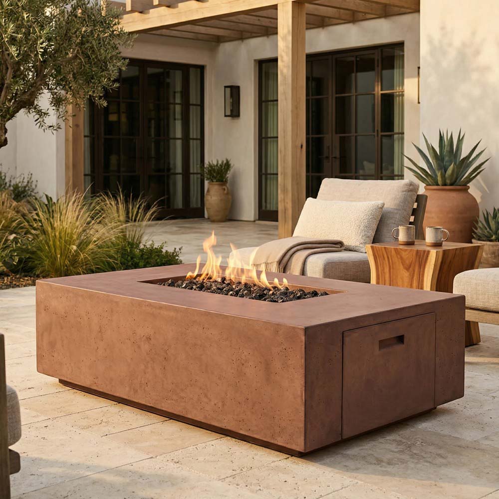 Warm beige concrete gas fire pit with flame on patio