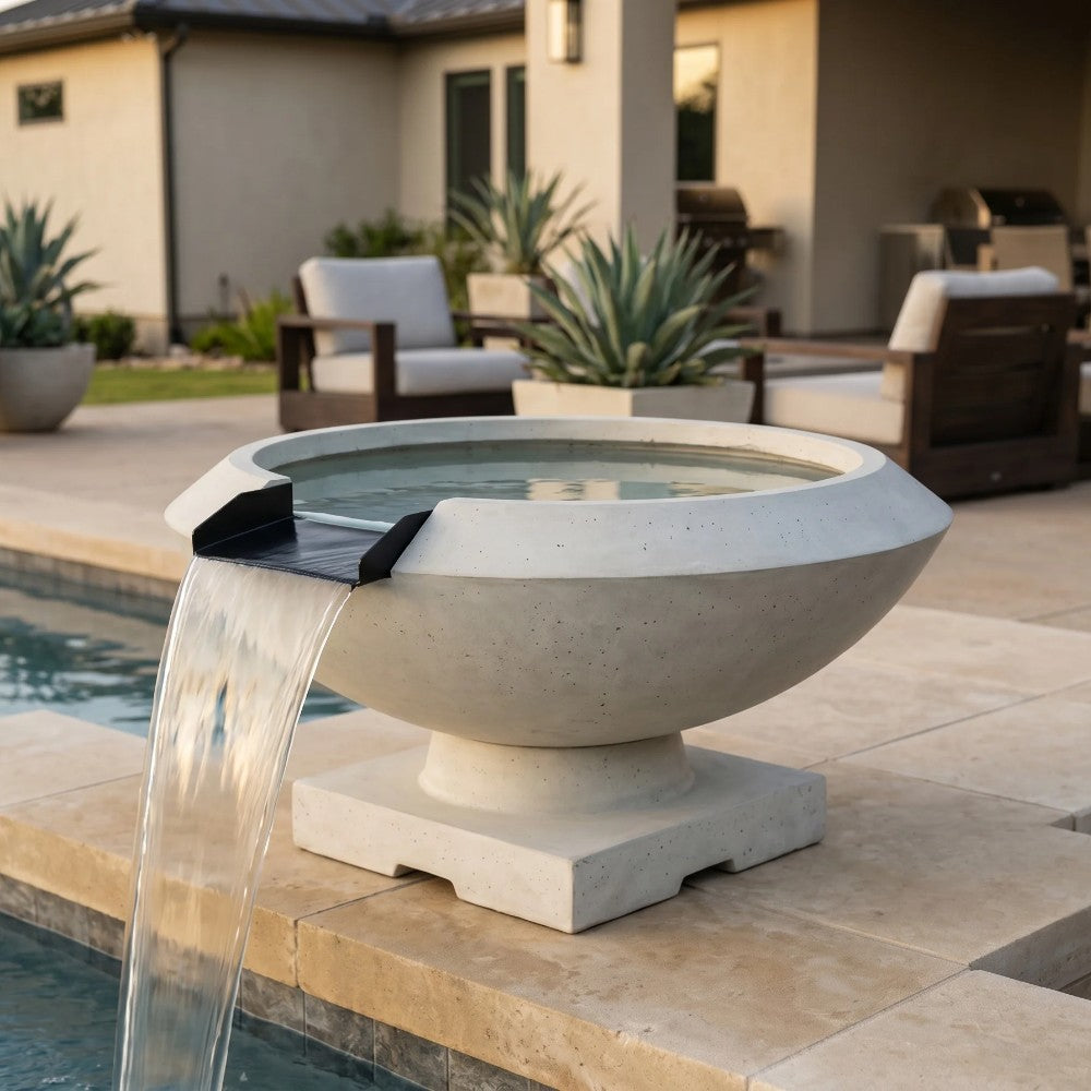 Light concrete gas fire and water bowl with water stream pouring over rim