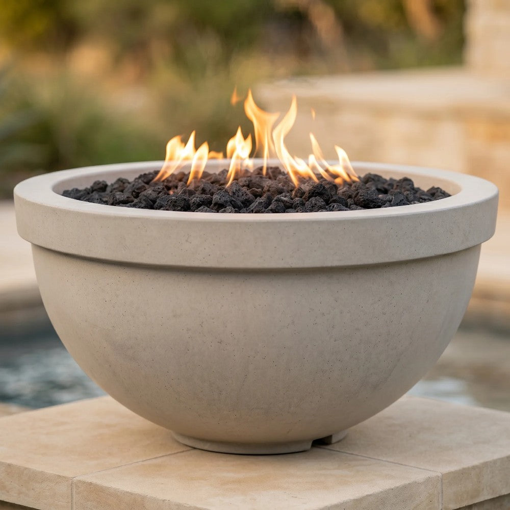 Light cream concrete gas fire bowl with flames and black lava rocks
