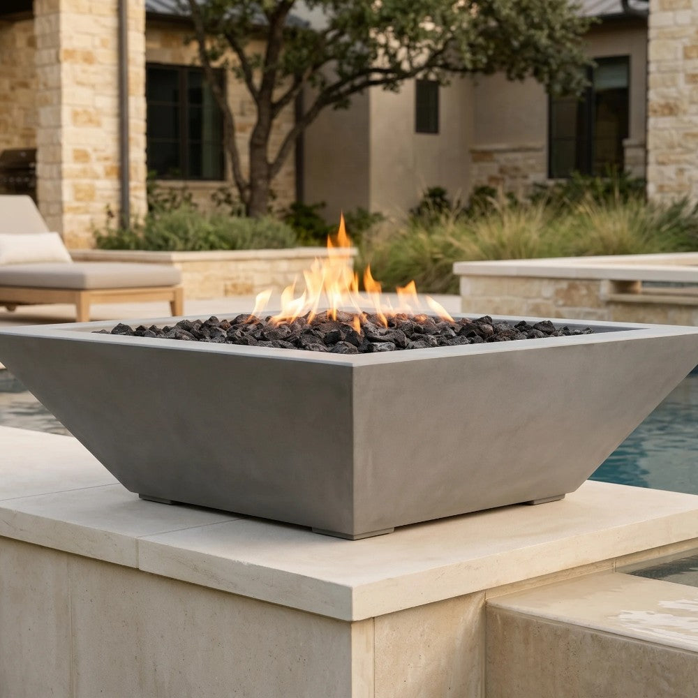 Concrete gas fire bowl with lava rock and flame, low square open top