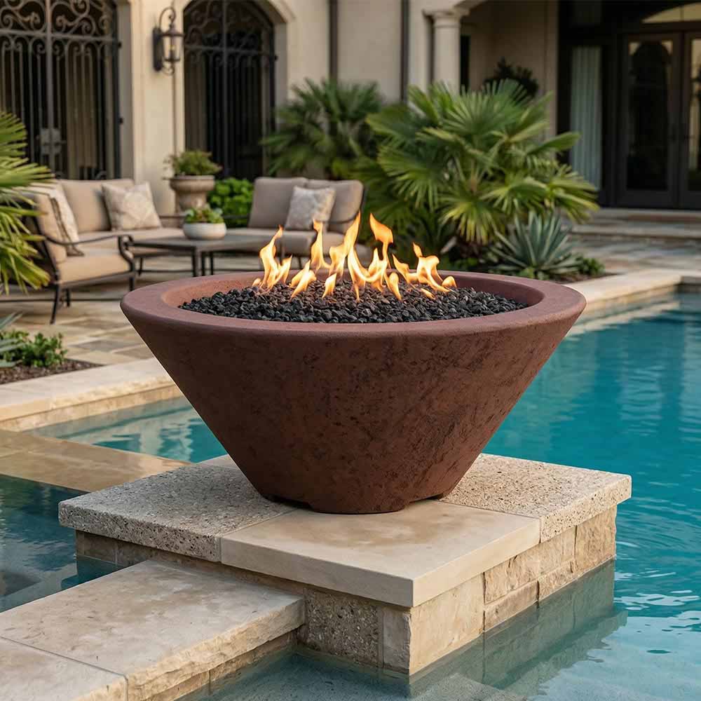 Small concrete gas fire bowl with dark lava rock and visible flames, rust-brown finish