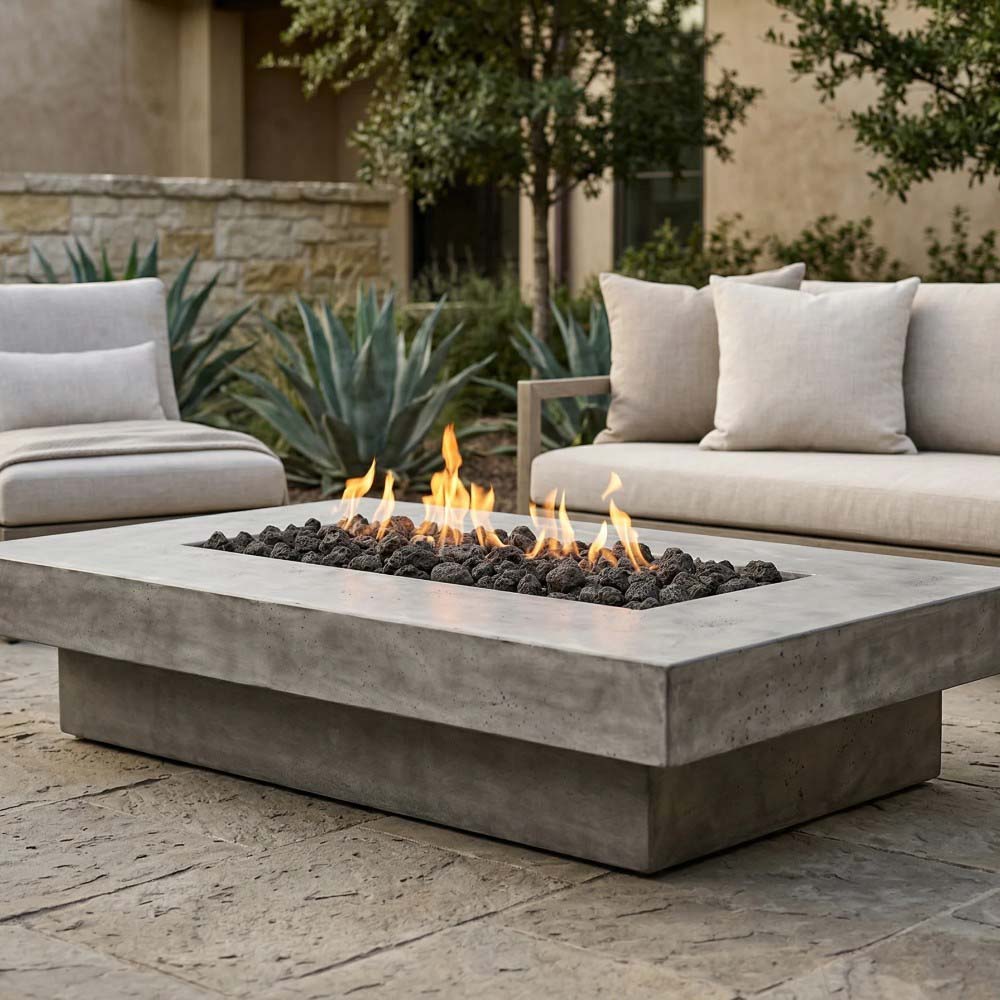 Rectangular concrete gas fire pit with visible flames and lava rocks in center
