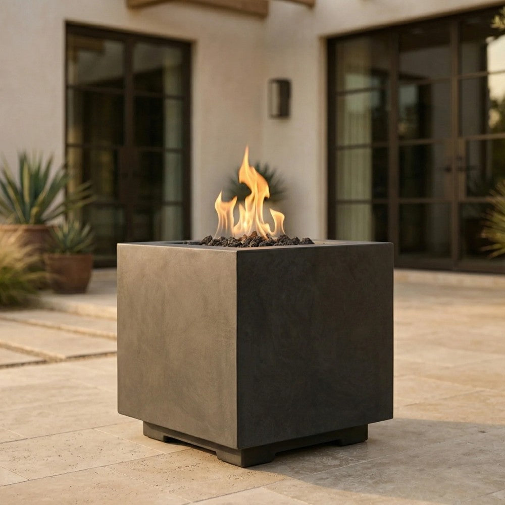 Dark gray square concrete gas fire pit with open top and visible flames.