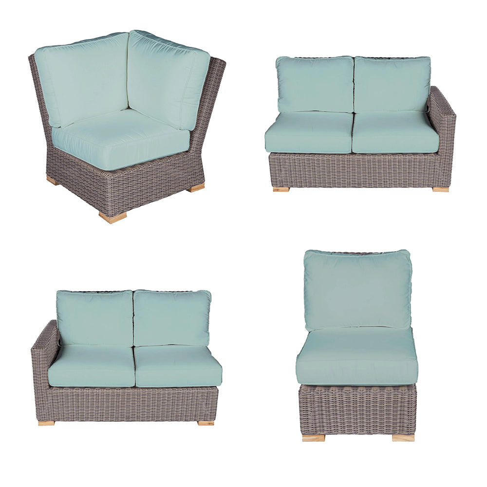 Outdoor sectional set with light blue cushions on dark gray wicker, corner and armless seats