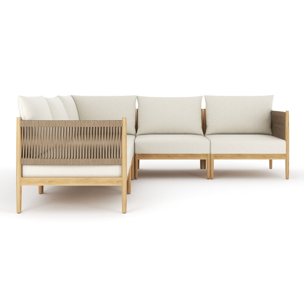 Outdoor sectional with cream cushions, light teak frame, and woven gray back panel