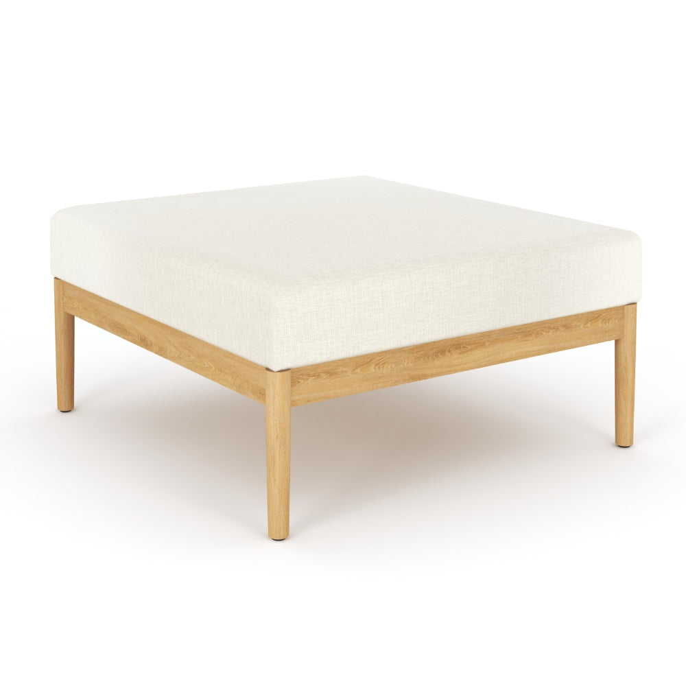 Square ottoman with light beige upholstered top and light wood frame, straight legs
